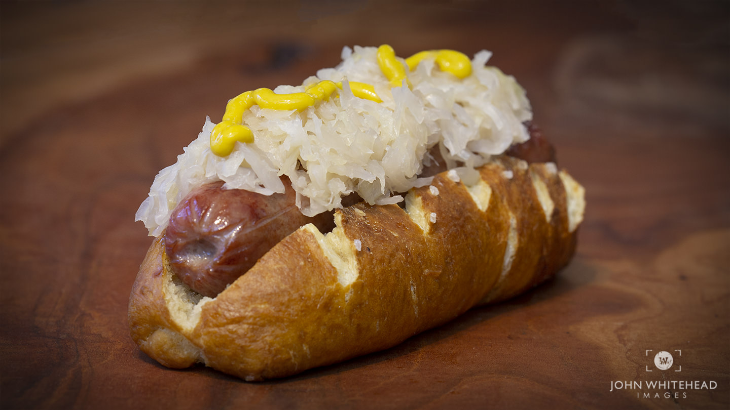 Bavarian soft pretzel bun with hotdog and sauerkraut.