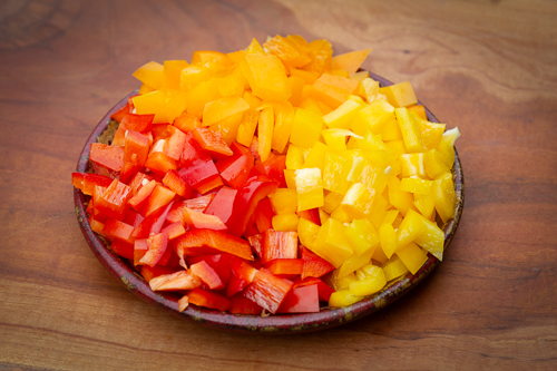 Diced yellow, orange, and red peppers